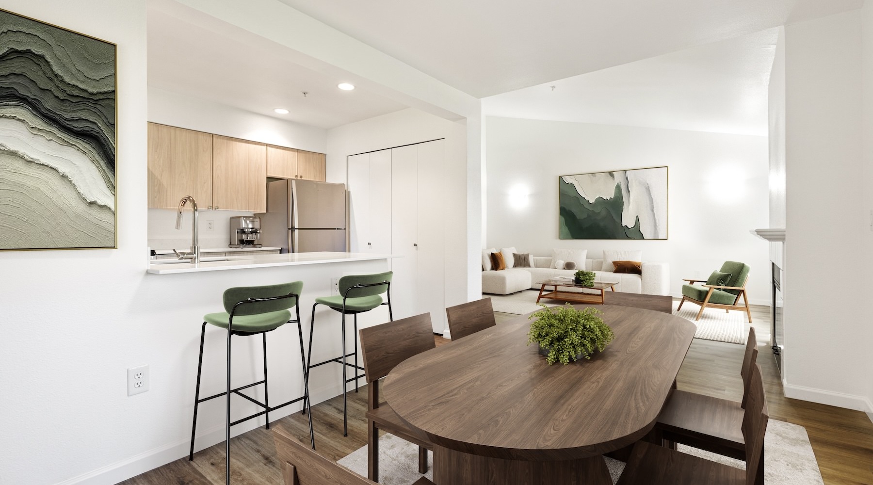 a kitchen with a dining table and chairs