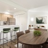 a kitchen with a dining table and chairs