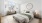 a bedroom with a bed and a bench