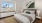 a bedroom with a large window